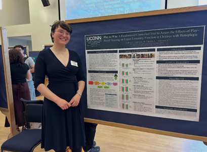 Student presenting in front of board